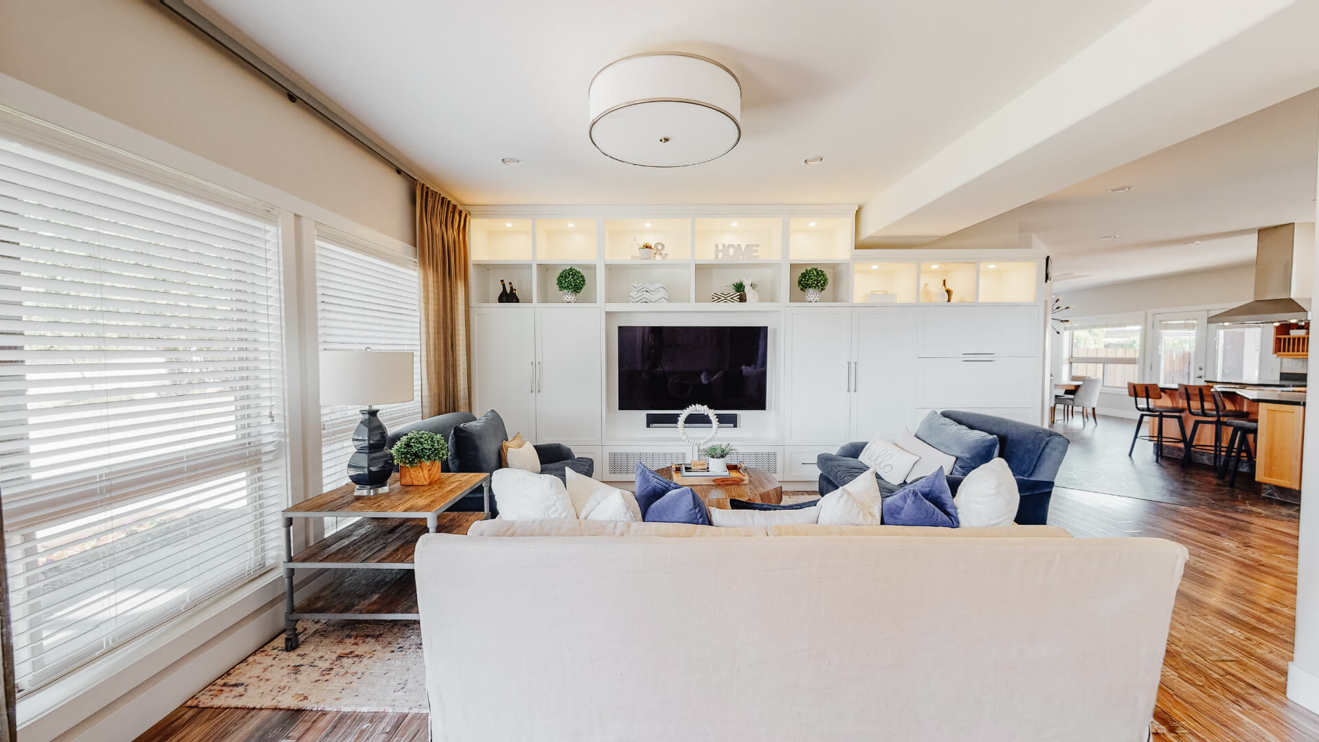 Image of sitting room, all white & gas fireplace.